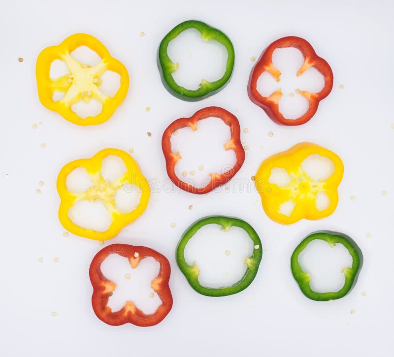 Set of sliced green yellow and red bell pepper