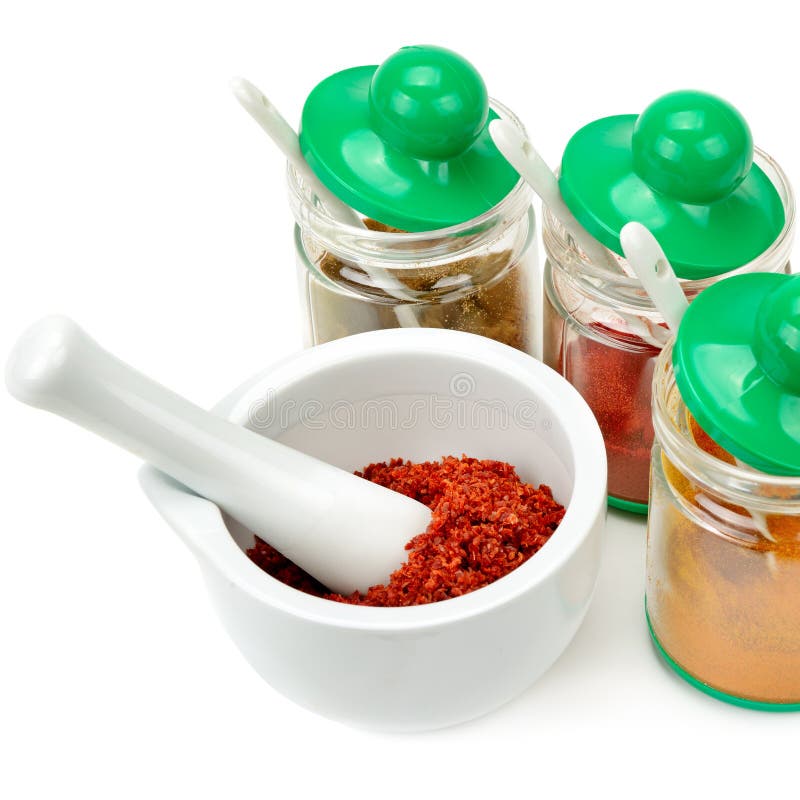Set of Spices and Mortar with a Pestle Isolated on White Background