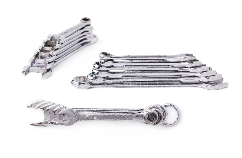 Set of stack of wrenchs metal instruments isolated over white background royalty free stock image