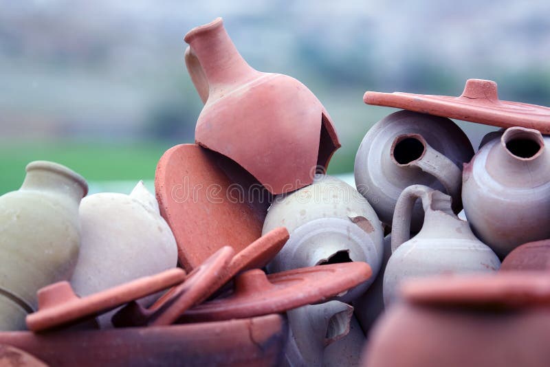 Set of stacked together broken clay pots