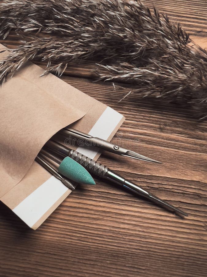 A Set of Sterile Manicure Tools in a Craft Package. Nail Salon Stock