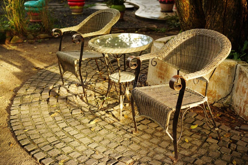 Old And Vintage Wood Table Set In The Beautiful Outdoor Garden Stock