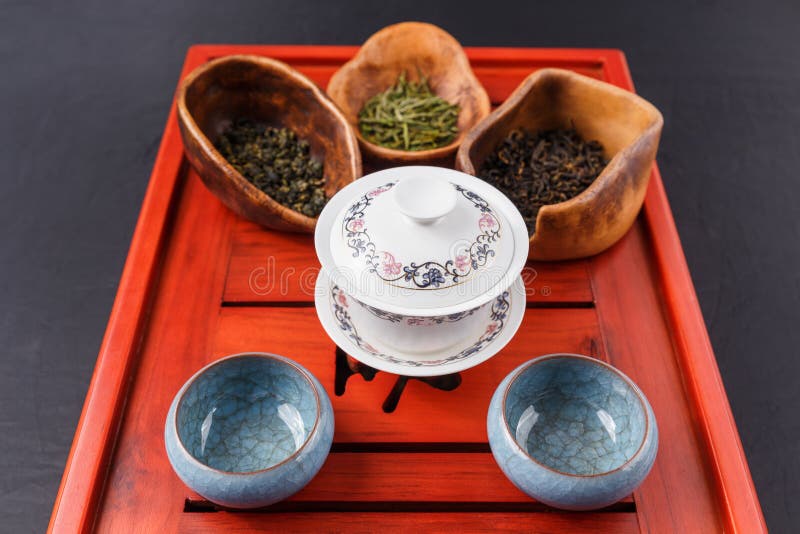 Set of Teapot, Three Kinds of Tea and Four Bowls Stock Image Image of