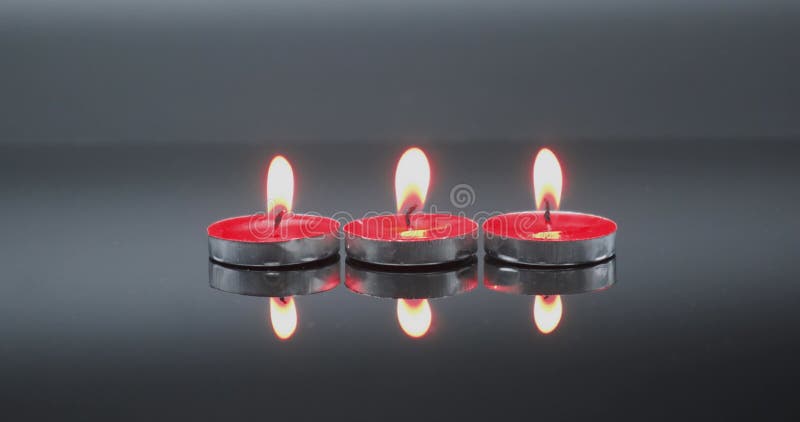 Three Candles Burning and Extinguished on a Black Background, Copy ...