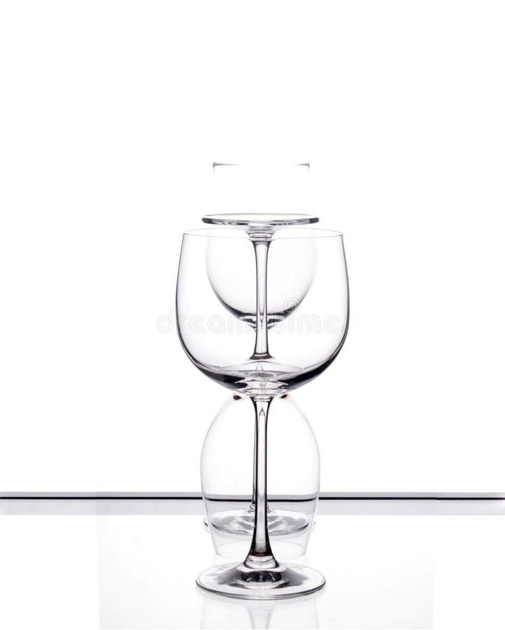 Three wine glasses arranged in a row. Three wine glasses arranged in a row.