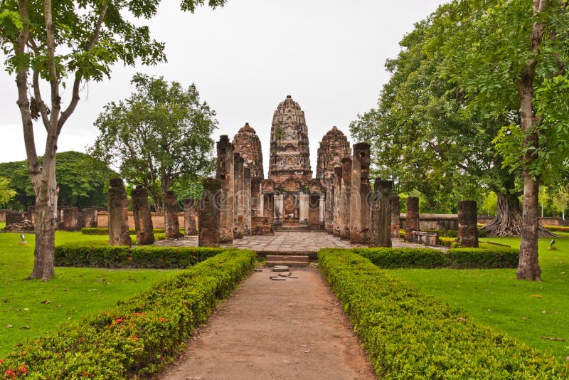 Set of three pagodas in sukhothai and walkway