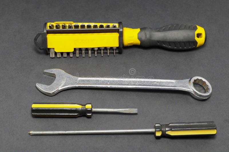 A set of tools on a gray background pliers, screwdriver. royalty free stock photos A set of tools on a gray background pliers, screwdriver. royalty free stock photos