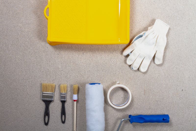 A Set of Tools for Painting Walls with Paint. Brushes, Tray, Roller on