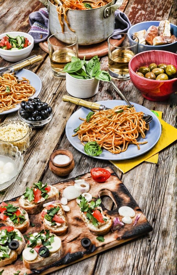 Set with traditional Italian food. Concept: Italian dinner with wine and spaghetti stock photos Set with traditional Italian food. Concept: Italian dinner with wine and spaghetti stock photos