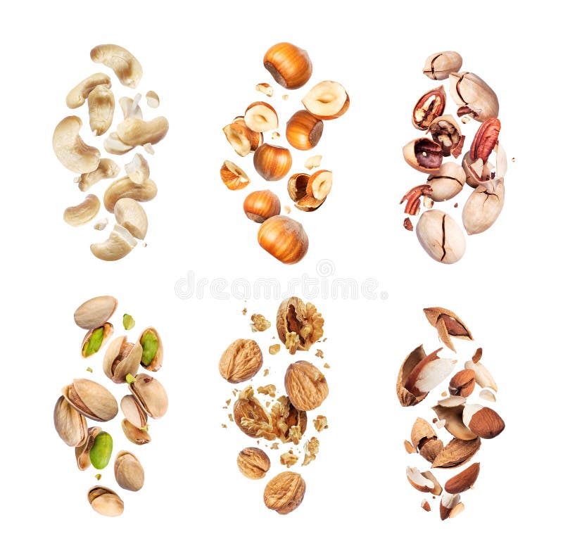 Set of various crushed dried nuts close-up in the air on a white background stock photography