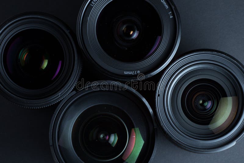 Set of Various DSLR Lenses with Colorful Reflections Stock Image