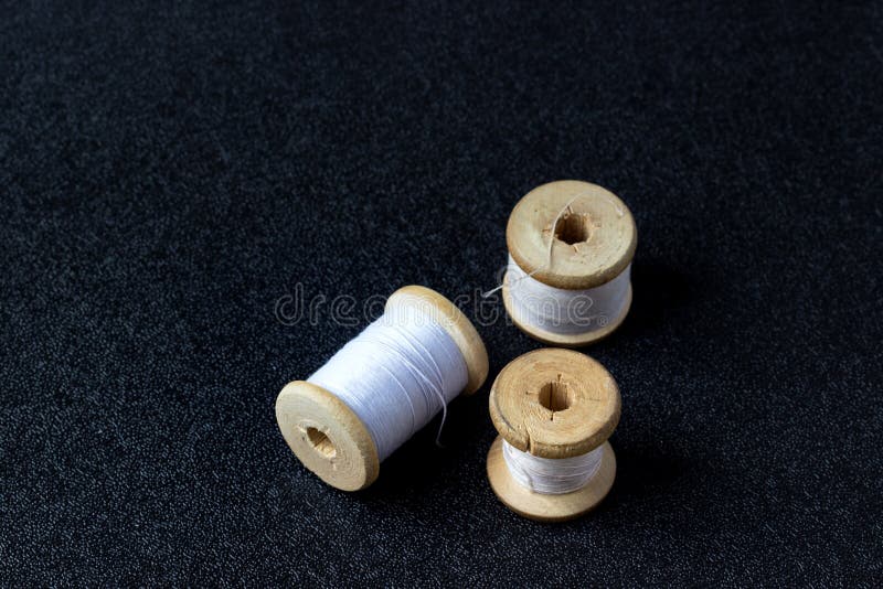 Set of Vintage Sewing Spools on a Black Background Stock Image Image