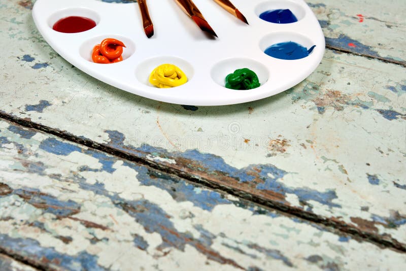 Set of watercolor aquarell rainbow paints and brushes on vintage stock images Set of watercolor aquarell rainbow paints and brushes on vintage stock images