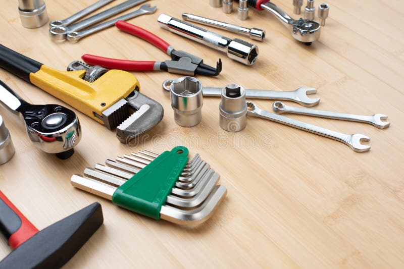 A Set of Working Tools, a Hammer, a Screwdriver, Adjustable Spanner