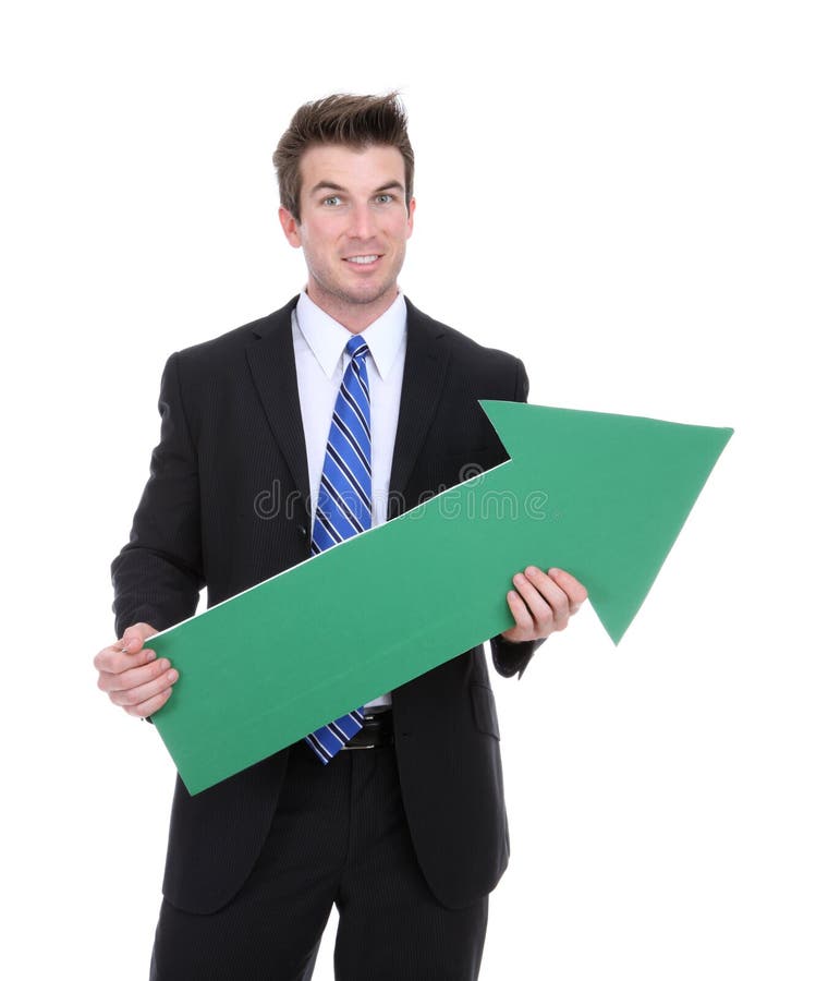 A business man holding a green arrow up indicating success. A business man holding a green arrow up indicating success