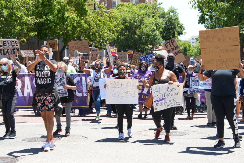 Berkeley, CA - June 13, 2020: Hundreds of people participating in a Black Lives Matter protest, protesting the death of George Floyd and others. Marching from RockRidge BART Station to Sproul Plaza. Berkeley, CA - June 13, 2020: Hundreds of people participating in a Black Lives Matter protest, protesting the death of George Floyd and others. Marching from RockRidge BART Station to Sproul Plaza