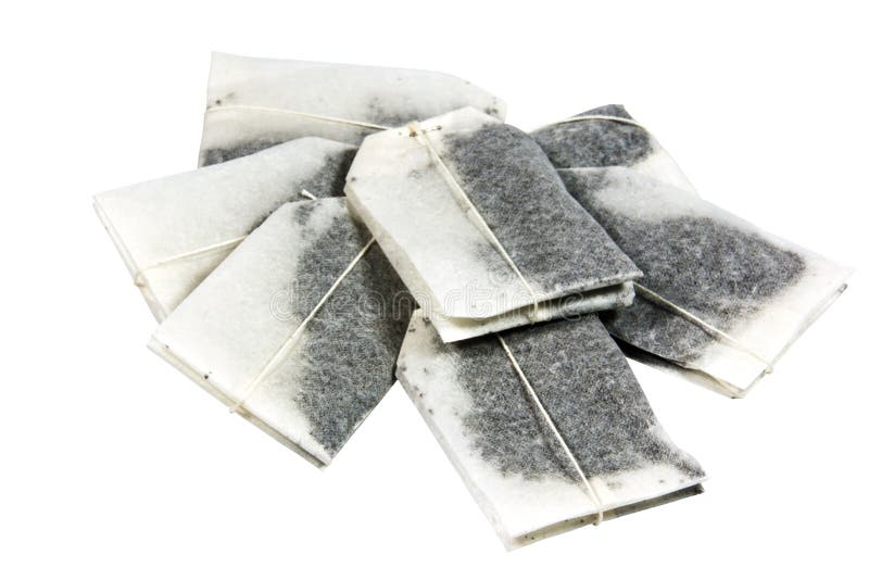 Sette bustine di tè etichettate inutilizzate disposte in un mucchio fotografie stock libere da diritti Sette bustine di tè etichettate inutilizzate disposte in un mucchio fotografie stock libere da diritti