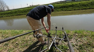 Setting Up the Carp Fishing Rods on Tripod Stand Stock Footage