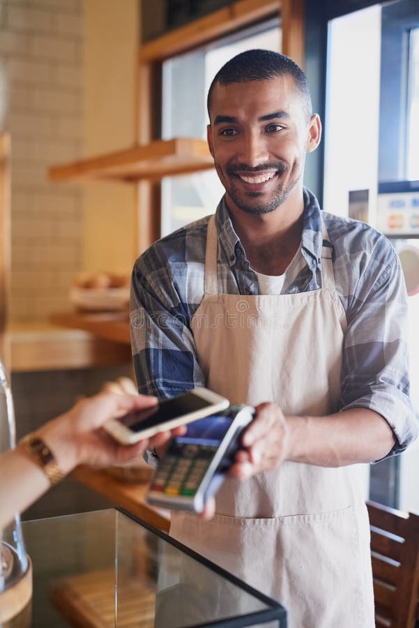 Settle Your Bill the Effortless Way. a Waitress Accepting a NFC Payment