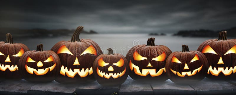 Seven spooky halloween pumpkins, Jack O Lantern, with an evil face and eyes