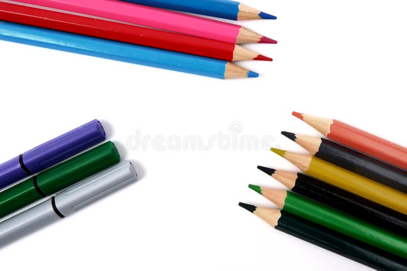 Several Colored Pencils and Markers on a White Background Stock Image