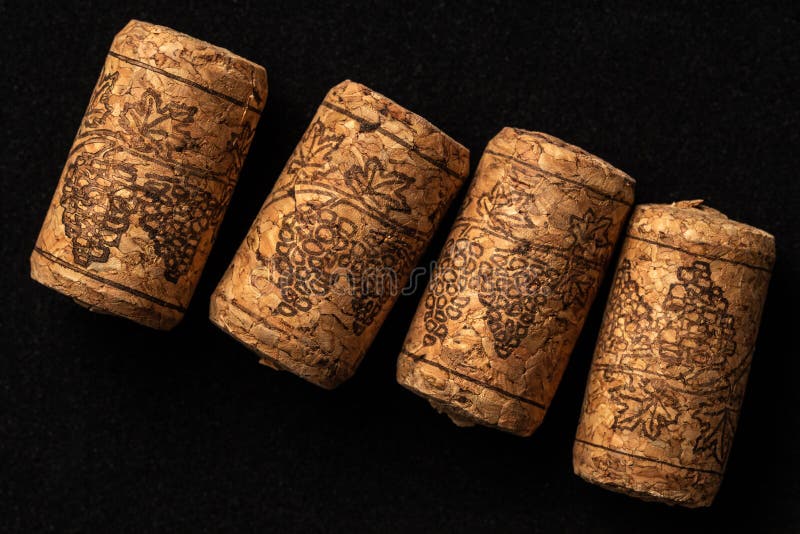 Several Cork Stoppers for Wine Bottles Over Black Background Stock