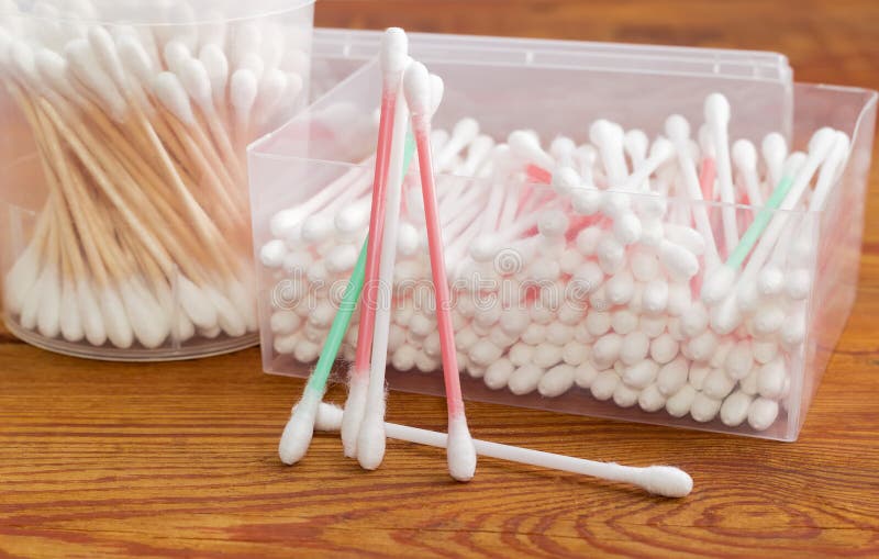 Several Cotton Swabs, Two Different Plastic Containers with Cotton