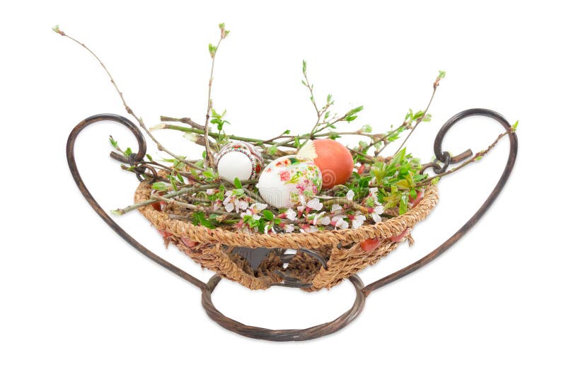 Several Easter Eggs on Branches with Leaves and Flowers Stock Image