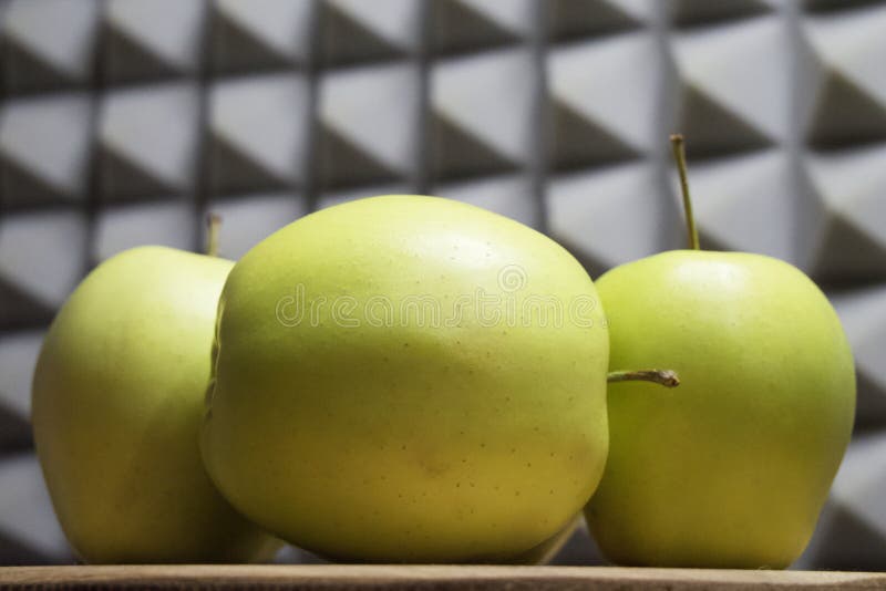 Several green apples, side view. Fruit close-up stock images