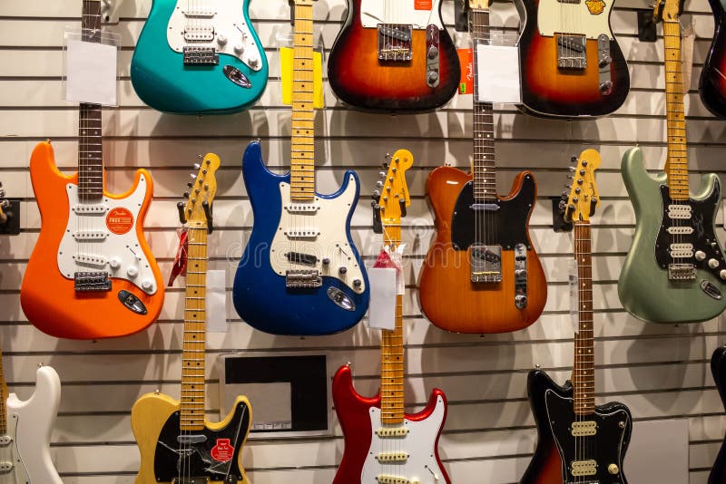 Several guitars at music store stock images