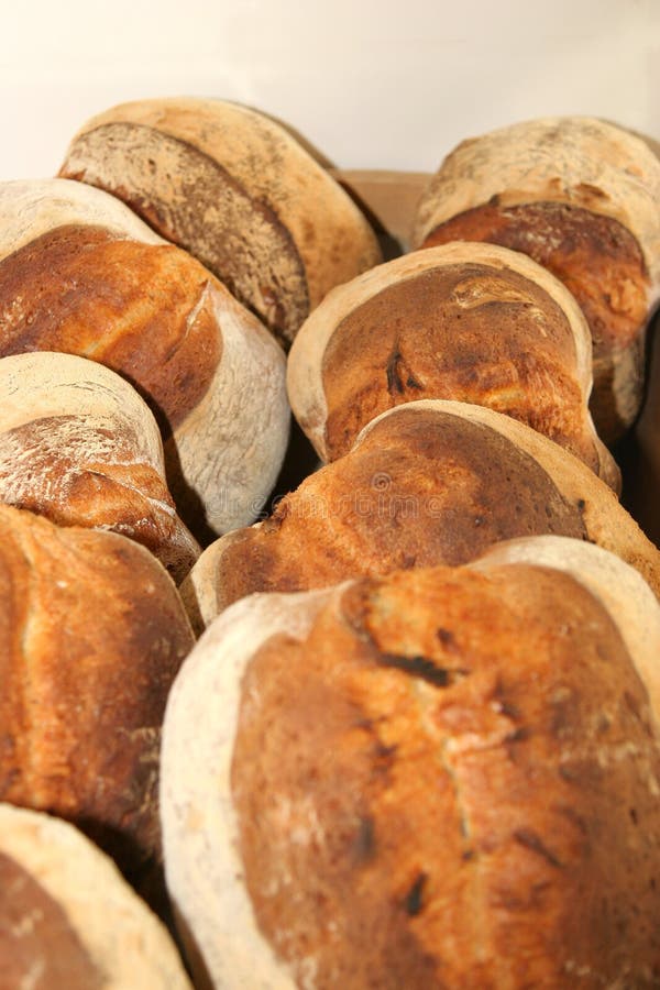 Several loafs of fresh hot bread