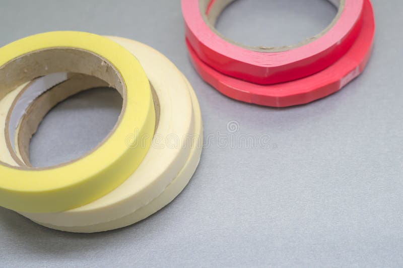 Several Rollers of Adhesive Tape for Different Purposes. Paint and Duct