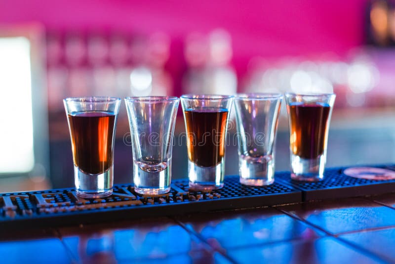 Several Shots of Different Drinks at a Party in a Stock Photo Image of barman
