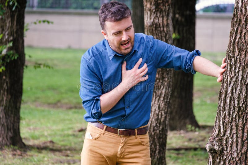 Man feels heartache suffering from cardio ailments and clutching