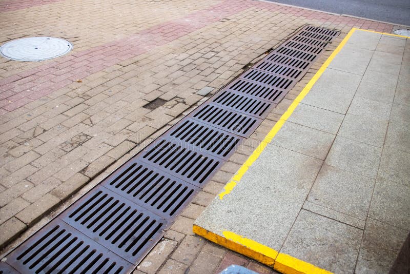 The Sewer Grate on the Sidewalk is Rusty Stock Photo Image of iron