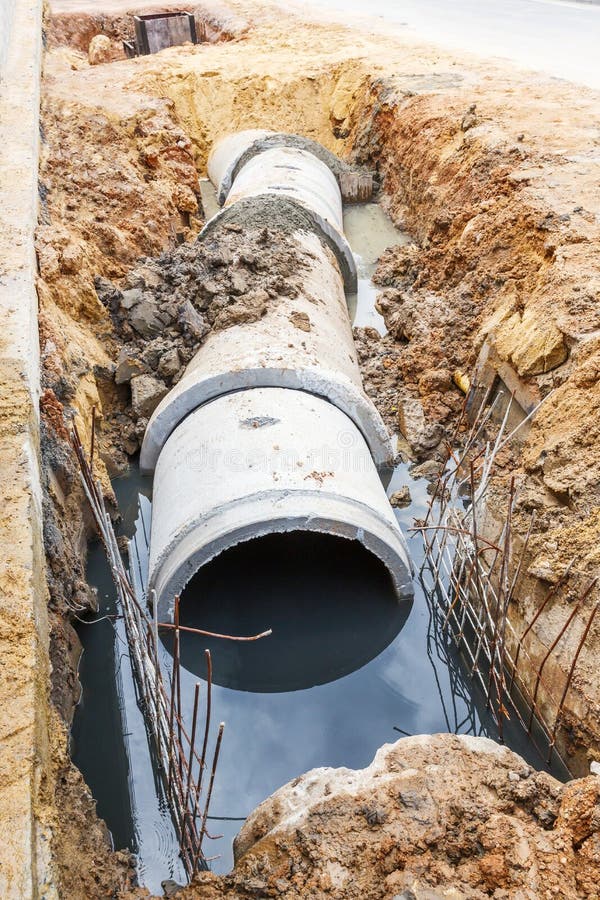 Sewer installation in city stock image. Image of industry - 66212661