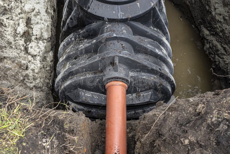 A sewer pipe with a diameter of 160 mm enters the septic tank tank, installation of a single-chamber home sewage treatment plant.