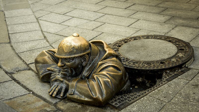 Sewer worker bronze royalty free stock photos