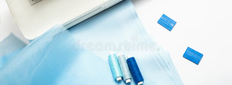 Sewing Concept. Blue Satin Fabric and Tulle with Thread and, Chalk and