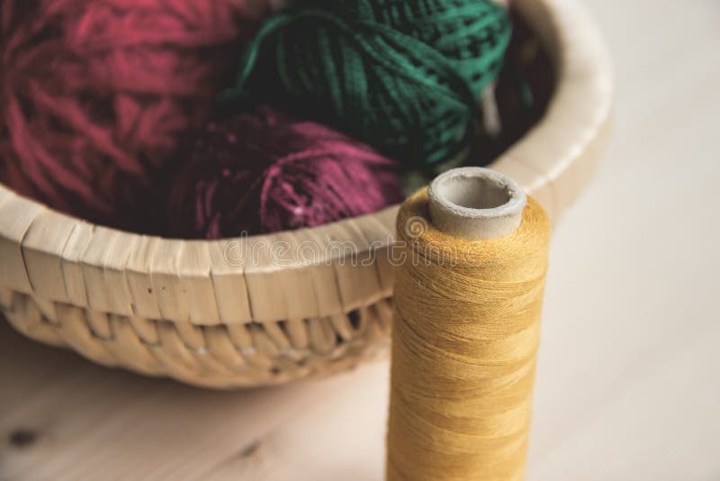 Sewing and Knitting. Knitting on a Wooden Background. Buttons in the