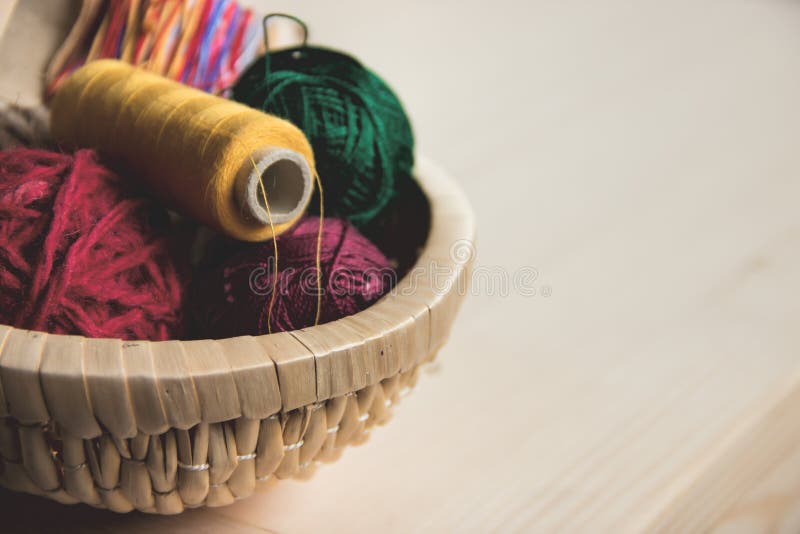 Sewing and Knitting. Knitting on a Wooden Background. Buttons in the