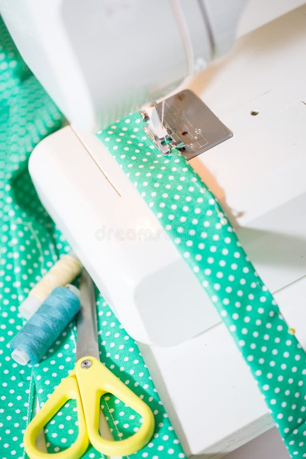 Sewing machine with cloth stock image. Image of craft 89600947