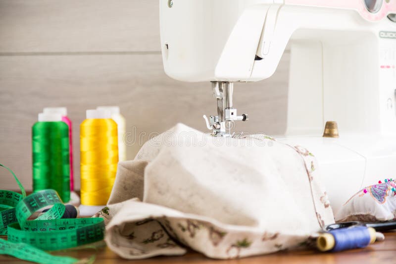 Sewing Machine with Fabric and Threads for Sewing, Closeup. the