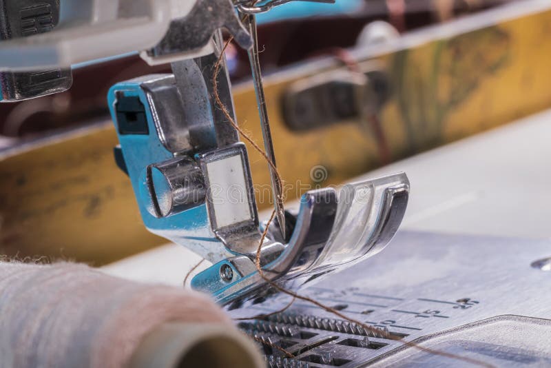 Sewing Machine. a Foot and a Needle with a Thread in the Center of