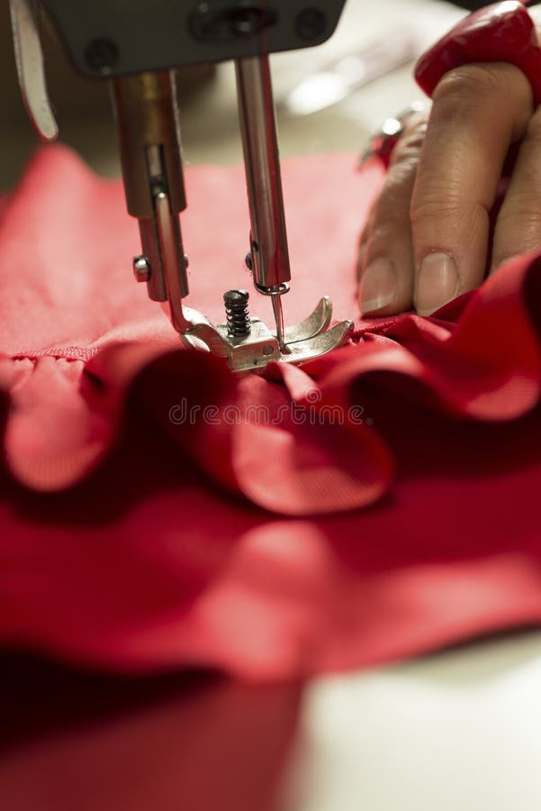 Sewing Machine Needle Piercing through Red Fabric Stock Photo Image