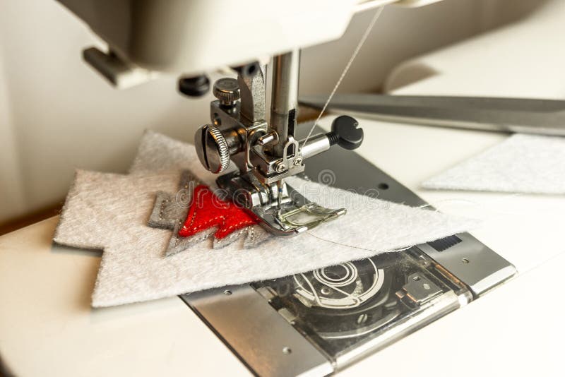Sewing Machine in the Process of Sewing Felt with Silver Threads Stock