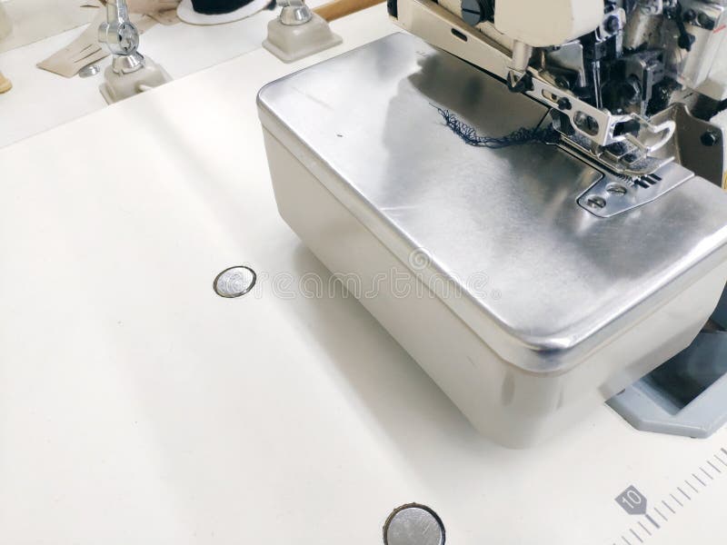 Sewing machine ready for work on a white tabletop background royalty free stock photography Sewing machine ready for work on a white tabletop background royalty free stock photography