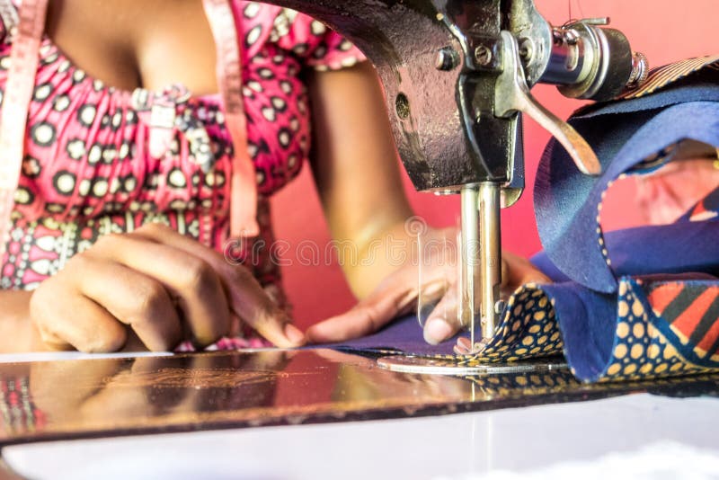 Sewing machine and tailor stock image. Image of material 86312829