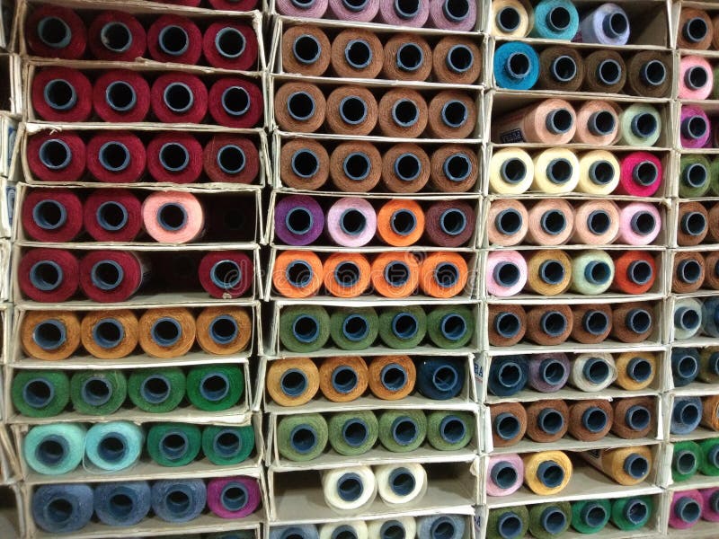 Sewing Machine Threads Arranged on the Tailor& X27;s Wall Stock Photo