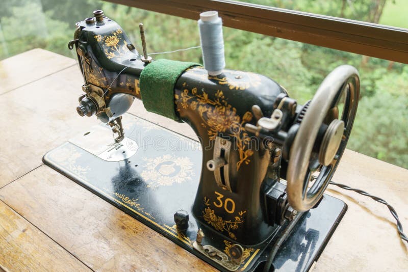 Sewing machine with tread stock photography